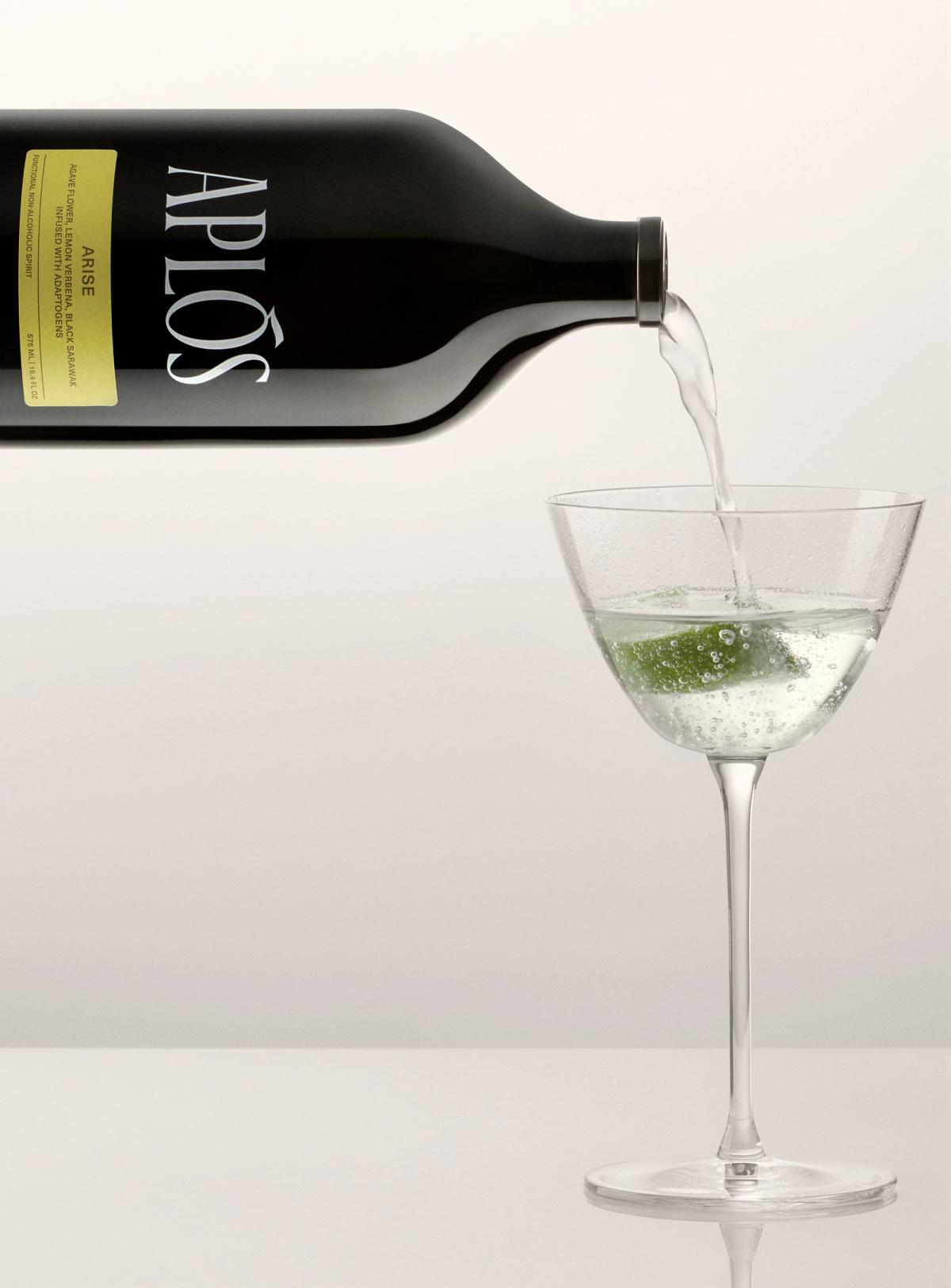 Aplos Arise bottle pouring into coupe