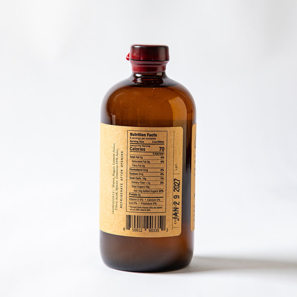 back of Brown bottle with a label on a white background