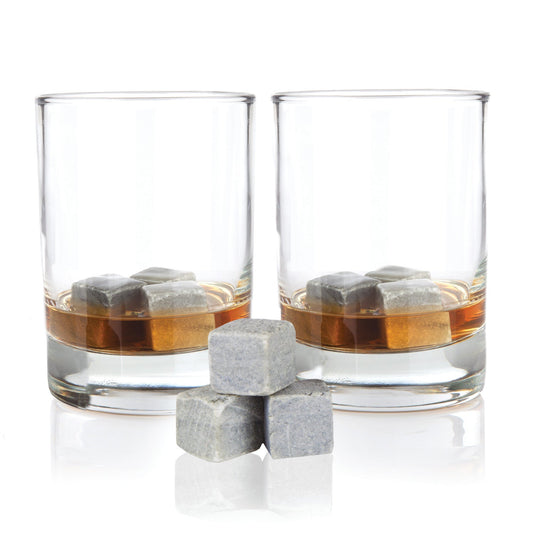 Two glasses of whiskey with ice cubes on a white background