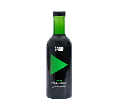 A bottle of Three Spirit Social Elixir, a non-alcoholic botanical spirit with a dark label featuring green text.