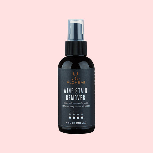 Black wine stain remover spray bottle with visible branding on a white background