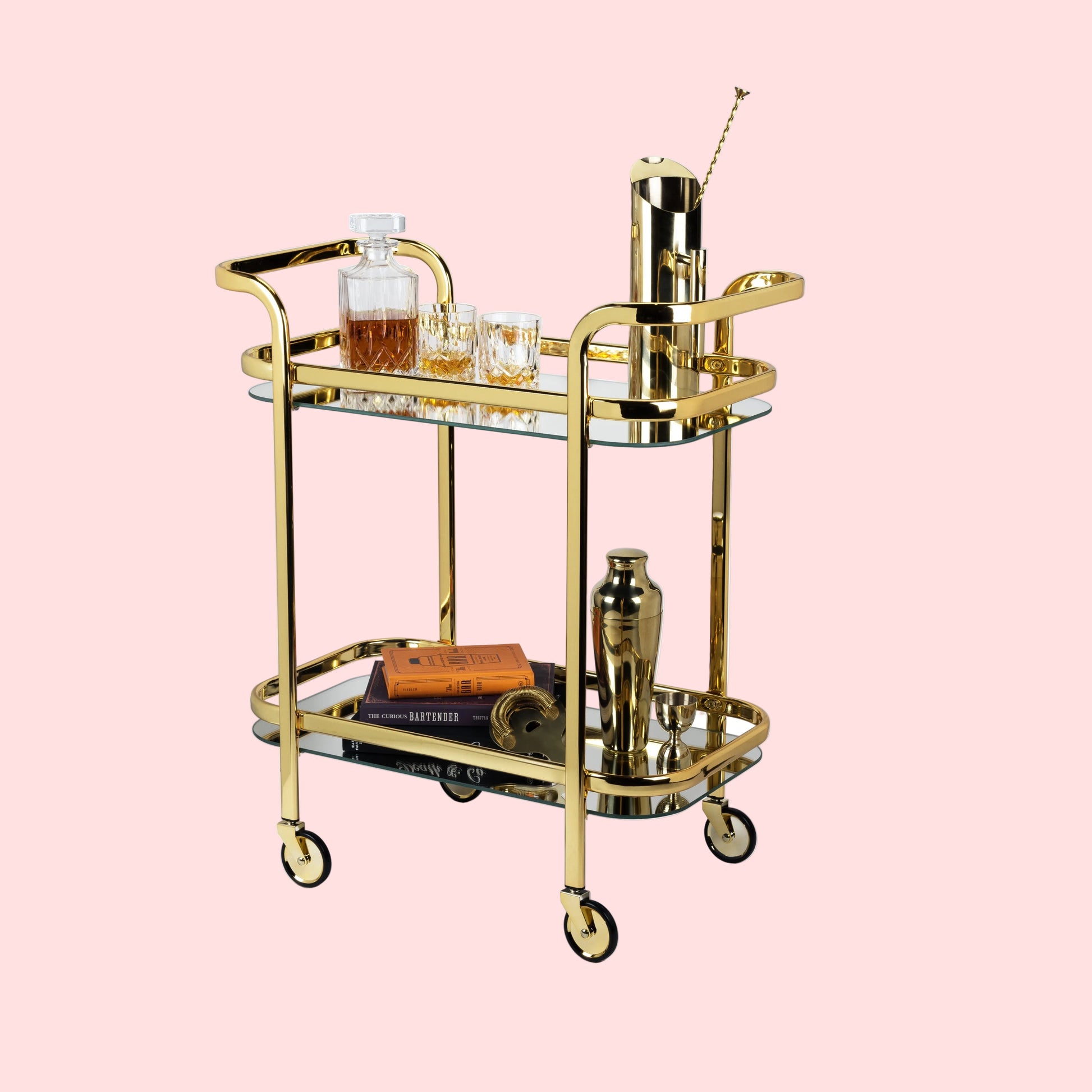 Gold bar cart with drinks and accessories on a white background