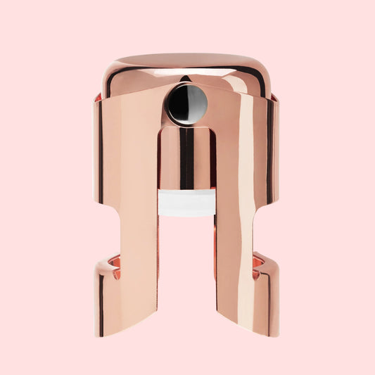 Rose gold lip balm on a white background
