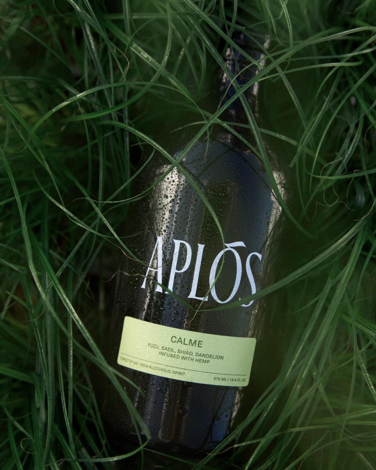 aplos calme bottle laying on grass